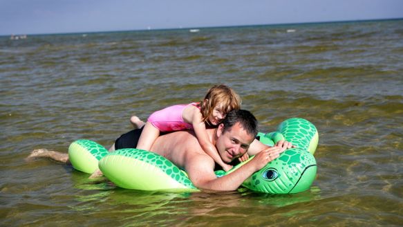 Family playing in the water near Aalborg
